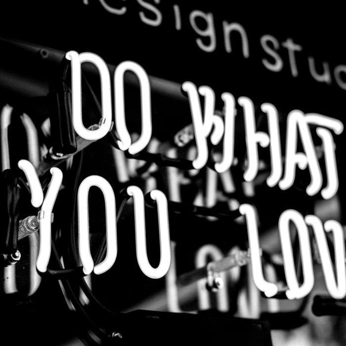 greyscale photo of DO What YOu Love signage