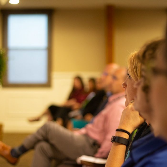 a group of people sitting in a room